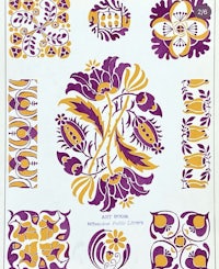 a white sheet with purple and yellow designs on it